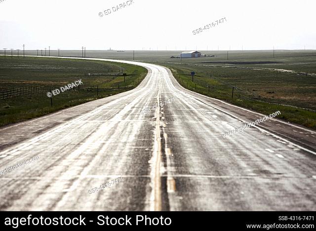 Empty road in afternoon light, Wyoming