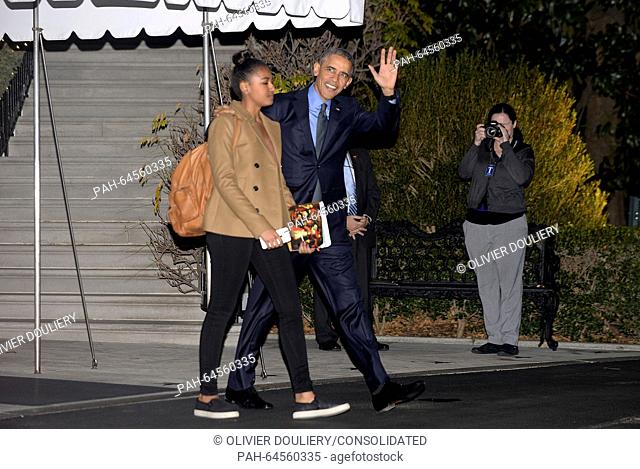 United States President Barack Obama and daughter Sasha depart the White House in Washington, DC, on December 18, 2015. The First Family will stop in San...