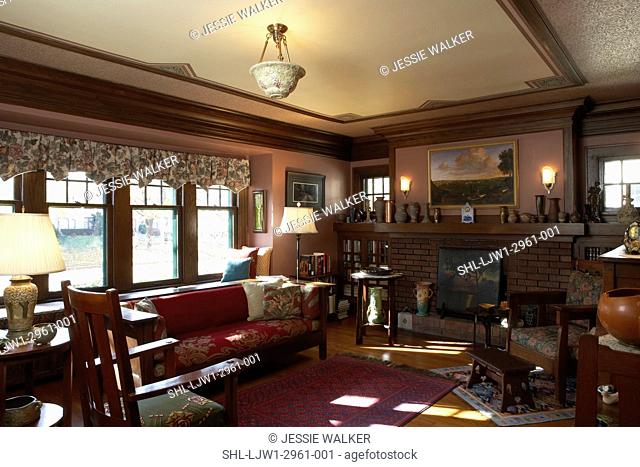 LIVING ROOM: Arts and Crafts style home, , brick fireplace, wood mantel with art pottery, floral valance, arts and crafts furniture
