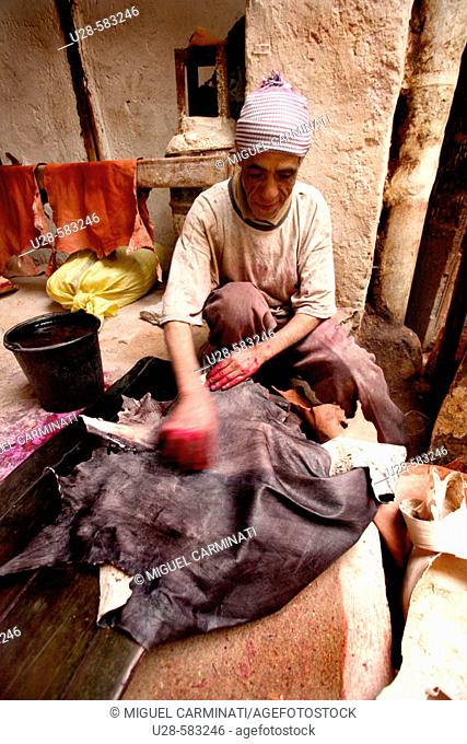 Man working in a tannery. Marrakech, Morocco