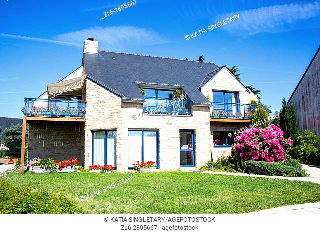 Typical blue brittany house made of stone and Gorgeous landscape and flowers France