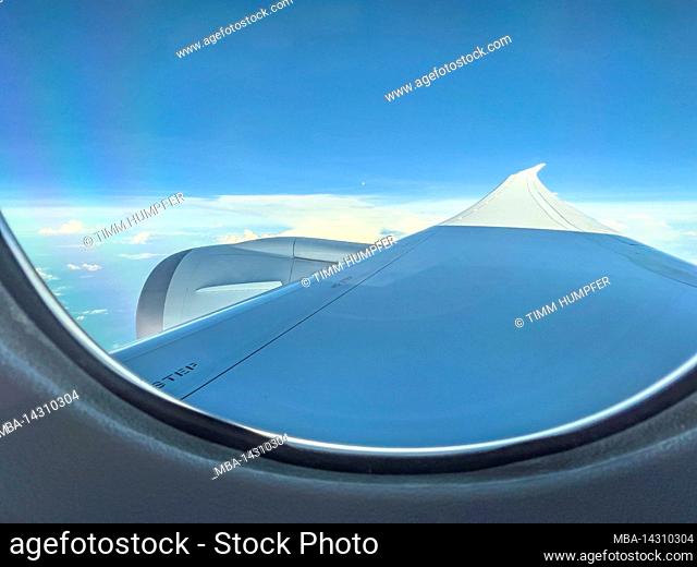 Air travel, view from airplane window over wing