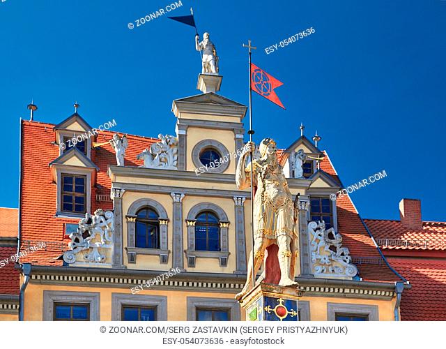Red Ox House (Haus zum Roten Ochsen in German), a historical building on Fish Market Square in Erfurt. The golden statue in front is known as