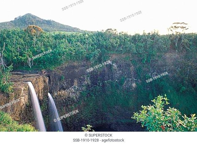 Wailua Falls in early morning with jungle vegetation USA Hawaii Kauai