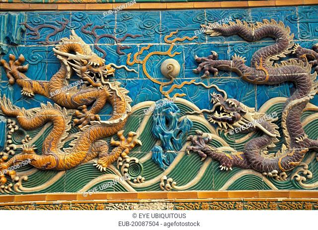 Beihai Park. Detail of Nine Dragon Screen constructed from coloured, glazed tiles and originally used to give protection from evil spirits to temple (now...