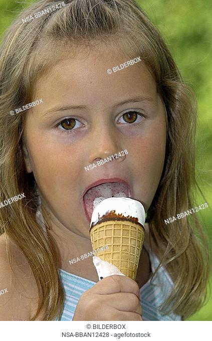Girl licks a ice-cream cone