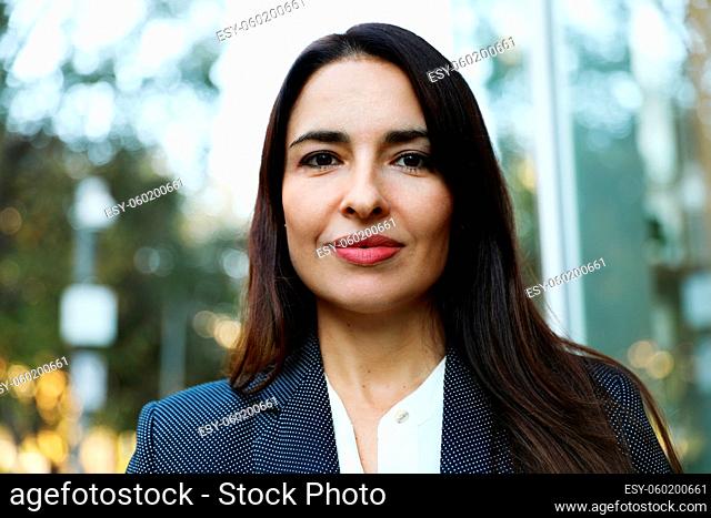 Portrait of happy smiling young businesswoman in office. High quality photo