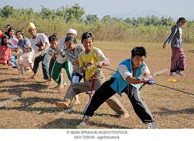 School children enjoying a tug of war game, Myitkyina, a largely Kachin community in north Burma near the Chinese border, Myanmar