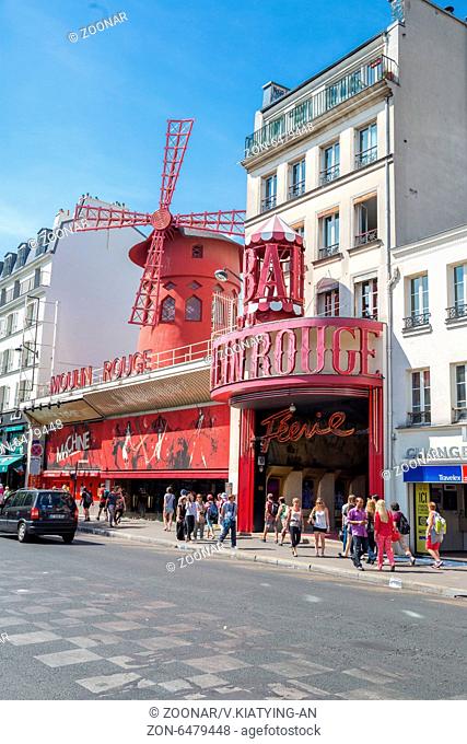 PARIS - JUN 22: The Moulin Rouge on June 22, 2014 in Paris, France. Moulin Rouge is a famous cabaret built in 1889, located in the Paris red-light district of...