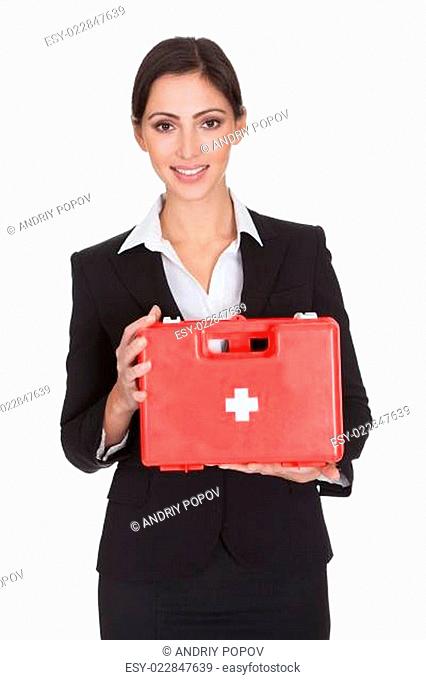 Happy Businesswoman Holding First Aid Box