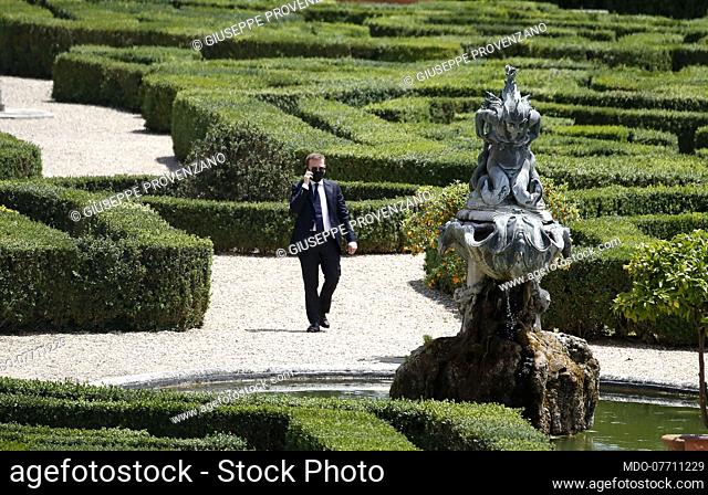 Italian minister Giuseppe Provenzano speaks on the phone in the gardens of the Casina del buon respiro, inside Villa Pamphilj