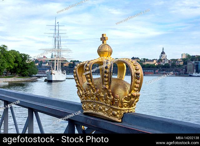 Sweden, Stockholm, old town, Skeppsholmbron, gilded crown, in the background AF Chapman