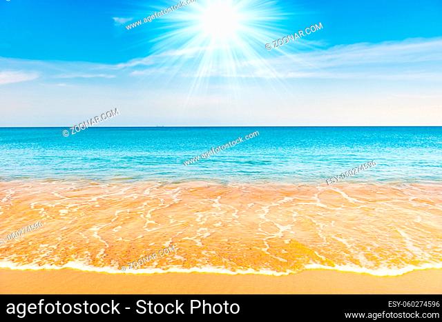 Blue sea water and sand beach with blue sky