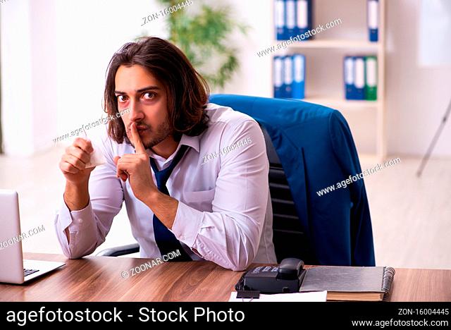 Drug addicted employee working in the office