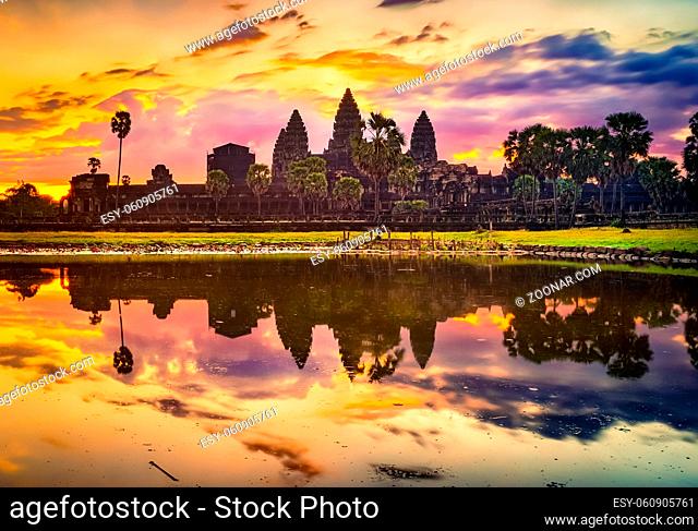 Angkor Wat temple reflecting in water of Lotus pond at sunrise. Siem Reap. Cambodia