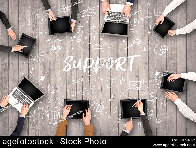 Group of business people working in office with SUPPORT inscription, coworking concept
