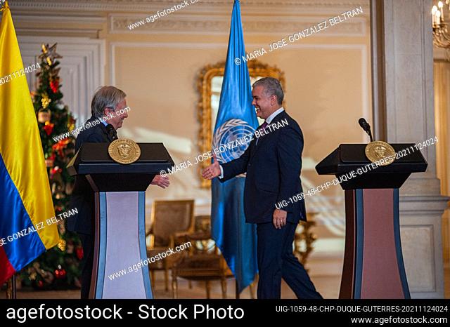 United Nations Secretary-General Antonio Guterres hughs and streches hands with Colombian President Ivan Duque after a press conference during the visit of the...