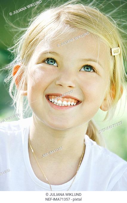 A Scandinavian girl smiling in the sun, Sweden