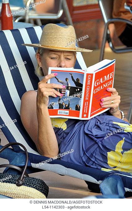 Woman Reading and relaxing on a Caribbean Cruise Ship
