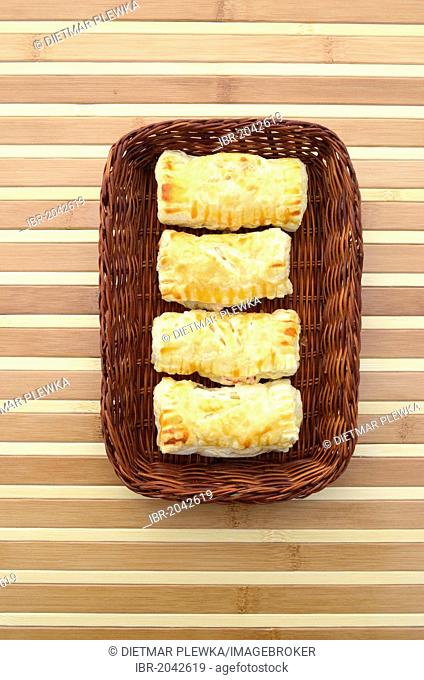 Homemade pastries, filled puff pastry in a breakfast basket