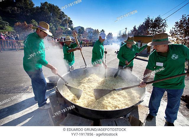 Group of men making crumbs  The crumbs are a traditional meal and delicious Andalusian  The Festival of the Crumbs in Torrox  Malaga, Andalusia, Spain, Europe