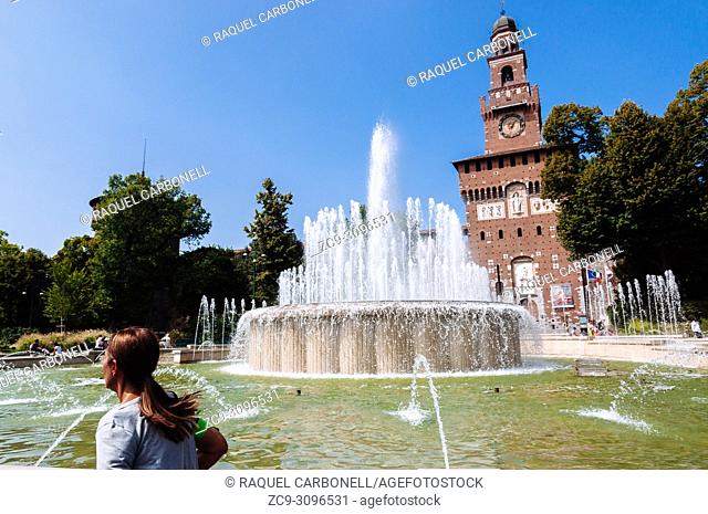 Piazza Castello square fountain with the Torre del Filarete in Sforza Castle at back, Milan, Lombardy, Italy