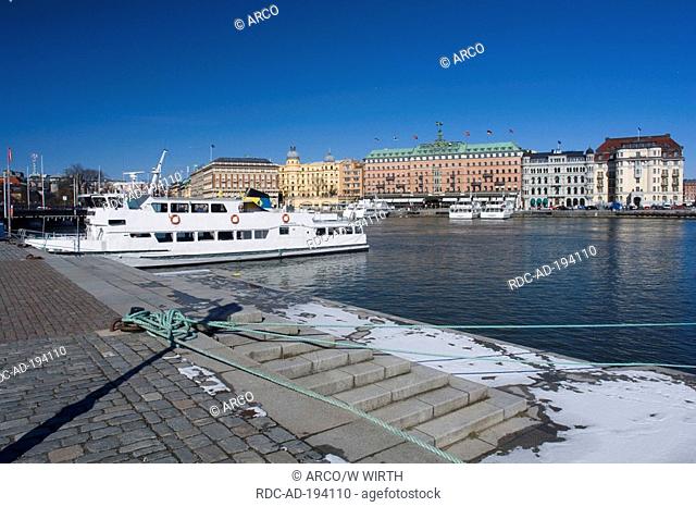 Ferry at landing stage, view on Grand Hotel, at river Stromkajen, Stockholm, Sweden, Strömkajen