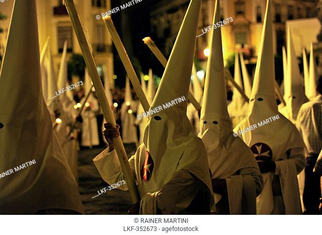 Nazarenos of the brotherhood La Borriquita during procession on Palm Sunday, Semana Santa, Sevilla, Andalusia, Spain, Europe