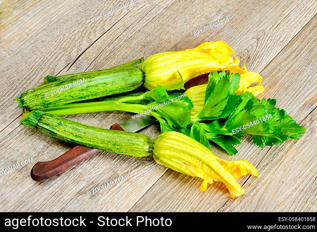 natural fresh zucchini flowers on wooden table