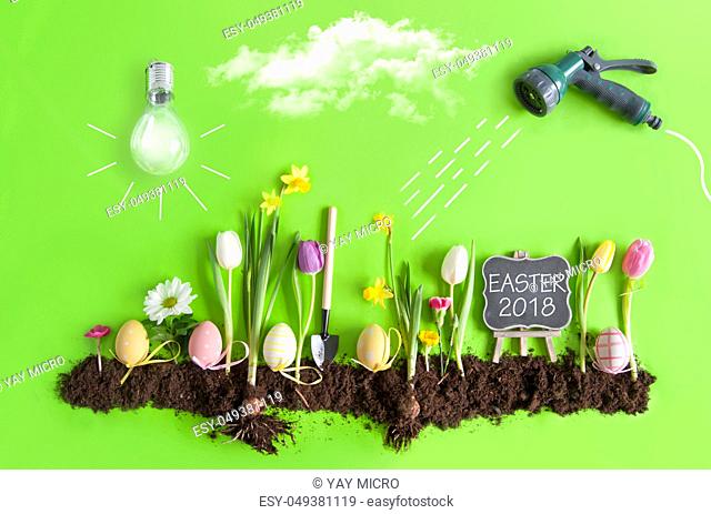 Easter flower bed garden with row of painted eggs amongst flowers, clouds, light bulb as the sun, and hose pipe with a sketch of water being sprayed