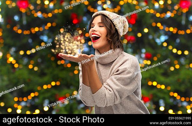 happy young woman with christmas magic