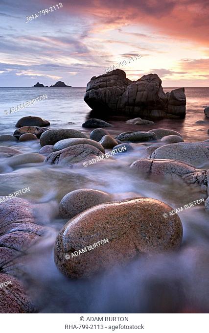 Porth Nanven cove and the Brisons Islands at sunset, Cornwall, England, United Kingdom, Europe
