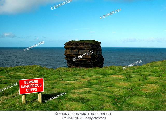 Downpatricks Head at Ireland with red warning sign