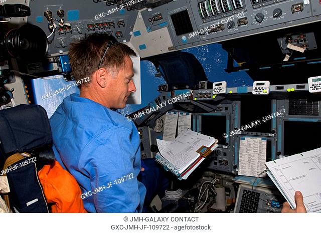 Astronaut Chris Ferguson, STS-126 commander, occupies the commander's station on the forward flight deck of Space Shuttle Endeavour during rendezvous and...