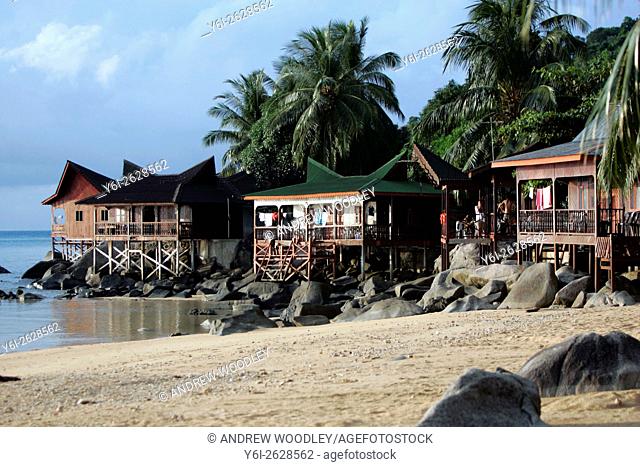 Picturesque Malaysian style beach bungalows on stilts Salang Beach Tioman Island Malaysia
