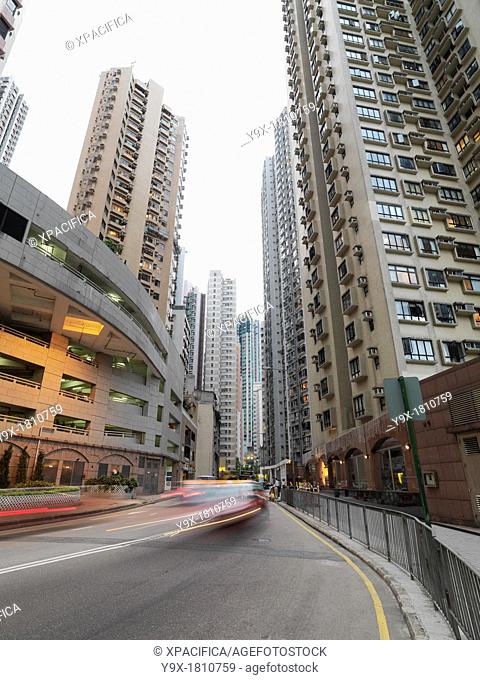 Vehicles drive on a street in Central, Hong Kong