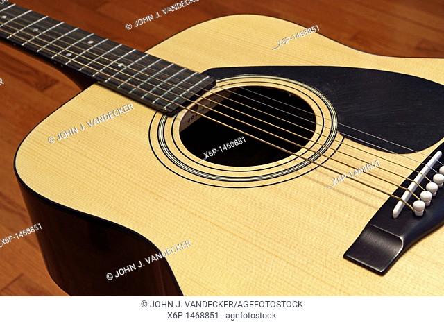 An acoustic guitar at rest