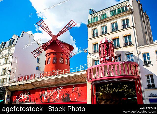 PARIS - MAY 15: The Moulin Rouge , on May 15, 2014 in Paris, France. Moulin Rouge is a famous cabaret built in 1889, locating in the Paris red-light district of...