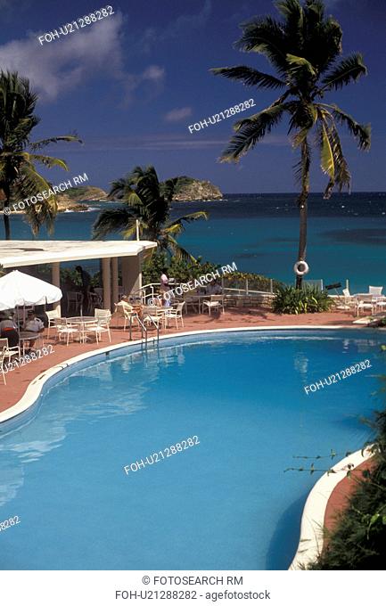 Antigua, resort, pool, Caribbean, Caribbean Islands, Swimming pool at hotel with palm trees on Half Moon Bay on the island of Antigua (a British Commonwealth...