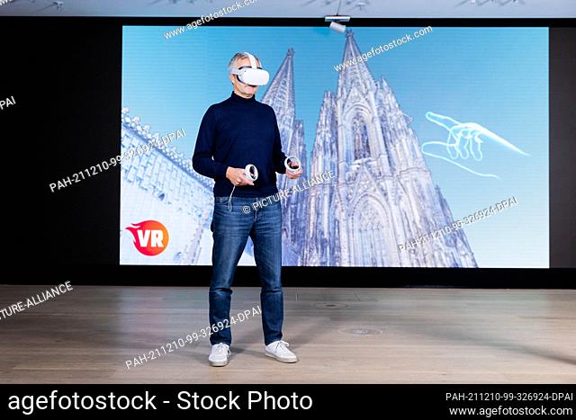 PRODUCTION - 30 November 2021, North Rhine-Westphalia, Duesseldorf: Johannes Ametsreiter, CEO of Vodafone Germany, stands in front of a screen at Vodafone's...