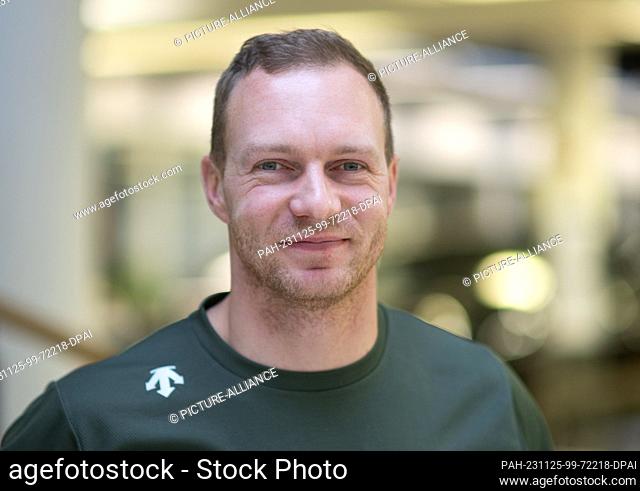 24 November 2023, Saxony, Dresden: Bobsleigh pilot Francesco Friedrich, stands on the sidelines of the press conference of the German Bobsleigh and Luge...