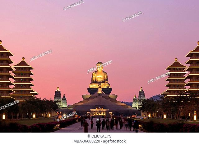 Kaohsiung, Taiwan. Sunset at Fo Guang Shan buddist temple of Kaohsiung with many tourists walking by