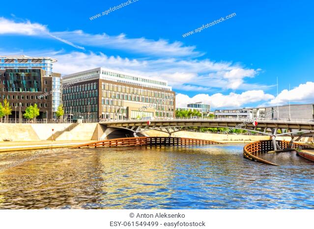 Bridge over the Spree and view on the modern buildings of Berlin, Germany