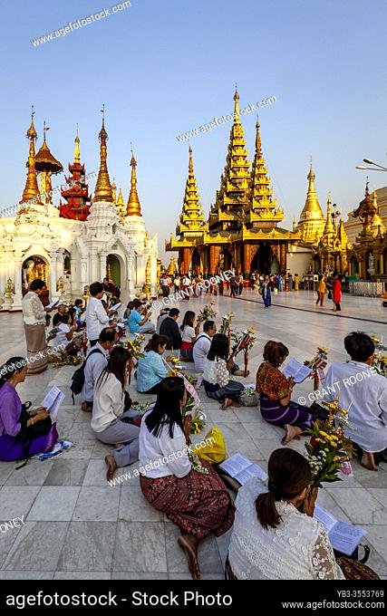 Buddhist People Praying At The Shwedagon Pagoda, Yangon, Myanmar