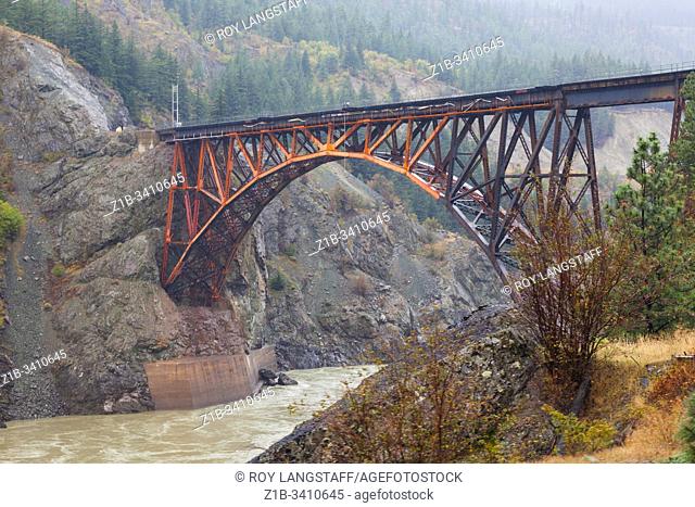 The trussed arch bridge of the Canadian National Railway crossing the Fraser River at Cisco Crossing in British Columbia