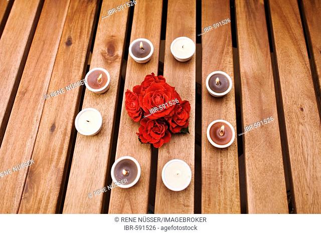 Roses surrounded by tea candles