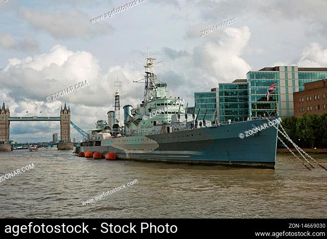 LONDON, UK - SEPTEMBER 08, 2017: HMS Belfast war ship on the Thames river with in London with the Tower bridge in the background