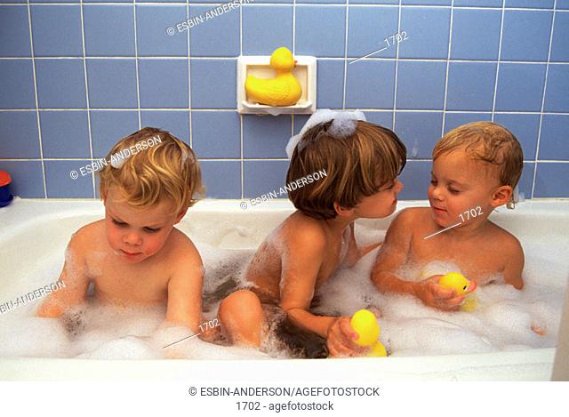 Three brothers take bubble bath