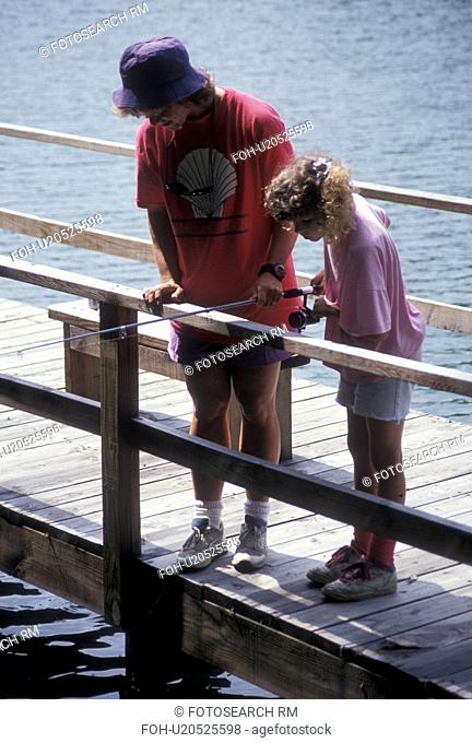 dock, fishing, lake, Chattahoochee National Forest, GA, Georgia, Mother and nine year old daughter fishing off a dock on Lake Tallulah in the Chattahoochee...