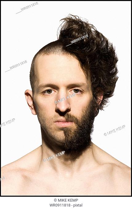 Man with half shaved head and beard